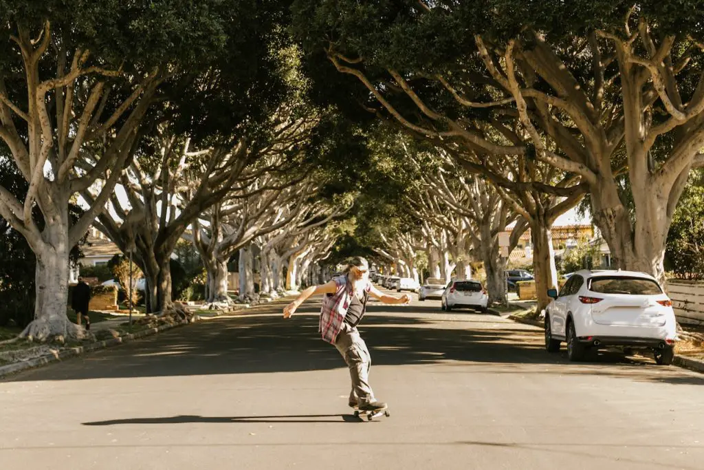 Image of a man skateboarding on a the road. Source: rodnae productions, pexels