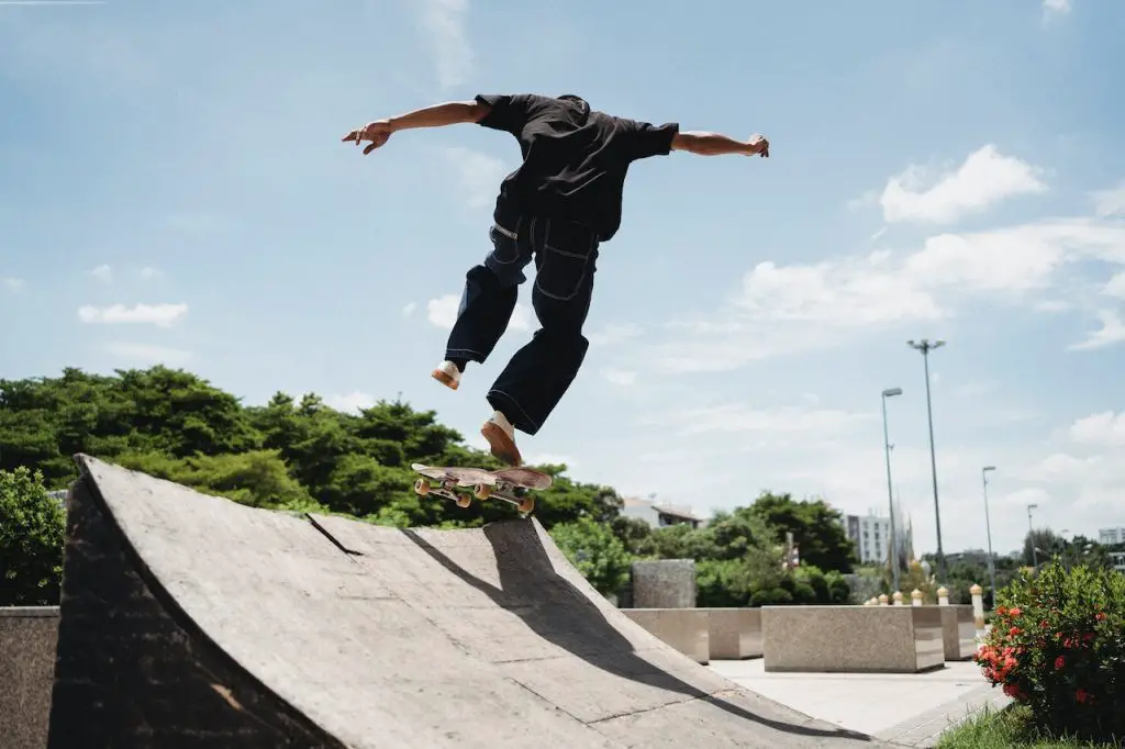 Image of someone performing on a quarter pipe. Source: allan mas, pexels