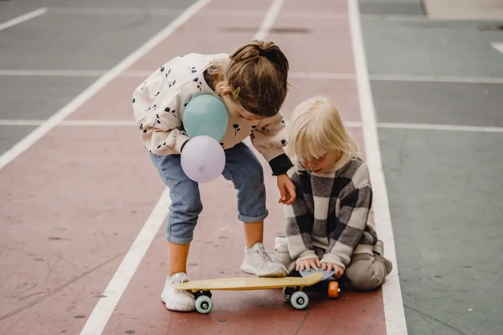 Image of young kids learning how to skateboard. Source: allan mas, pexels