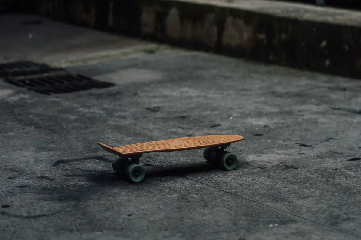 Image of a cruiser skateboard on a concrete pavement. Source: unsplash