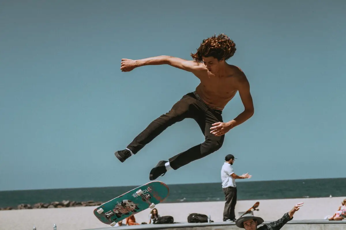 Image of a skateboarder in midair. Source: unsplash