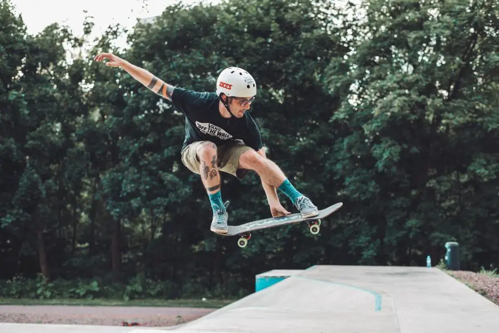 Image of a skater doing a jump on a skateboard. Source: pexels