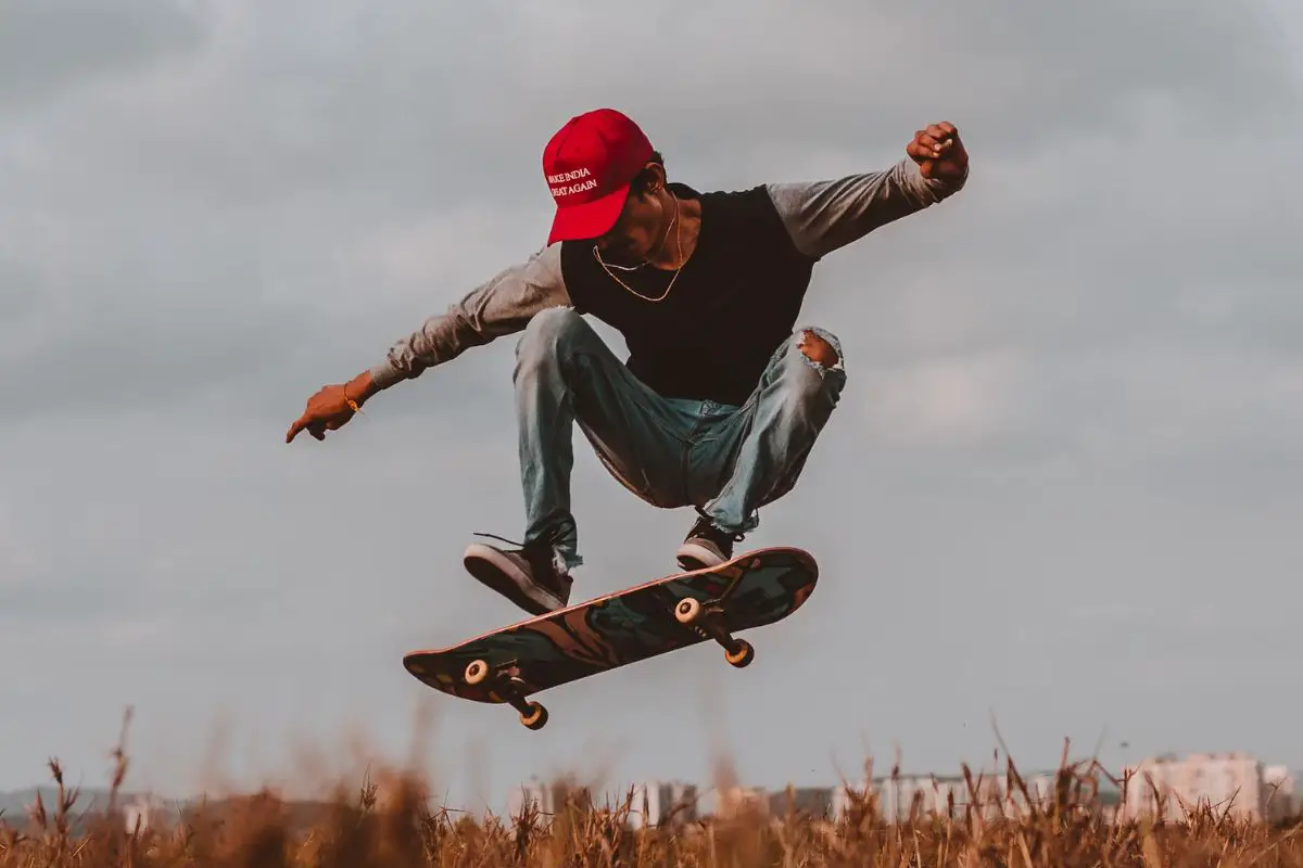 Image of a skateboarder doing some trick.