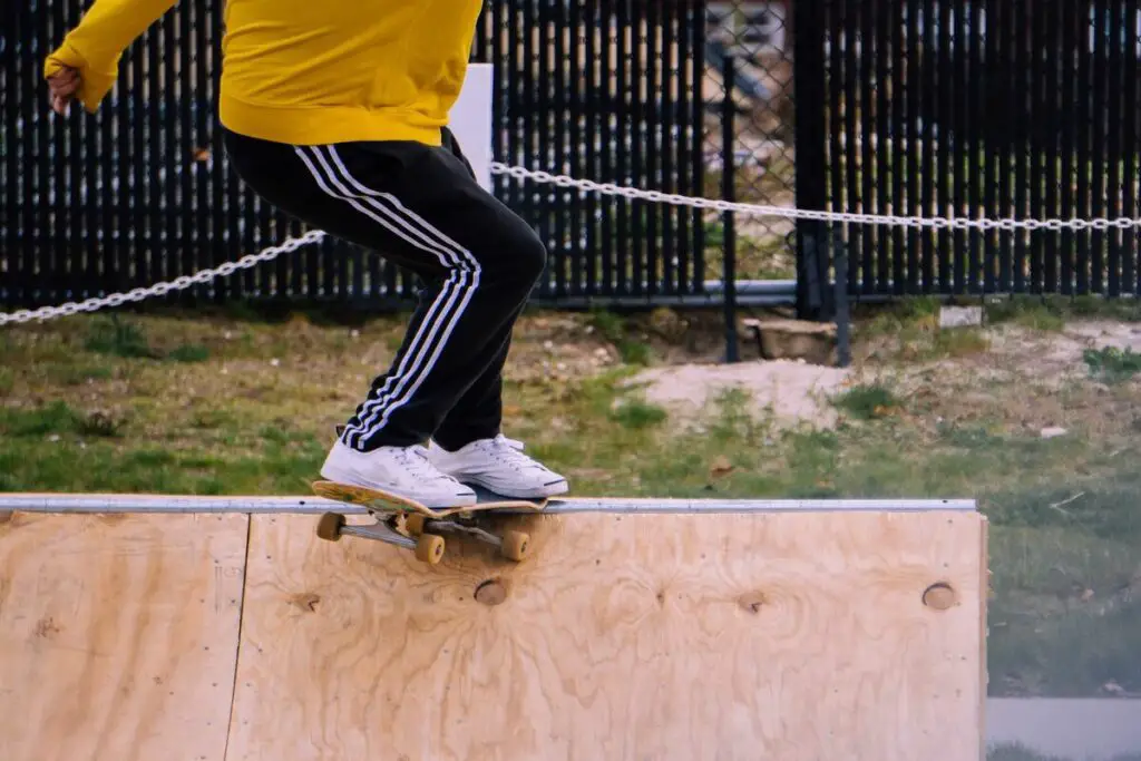 Image of a skateboarder doing a tall in a skatepark. Source: unsplash