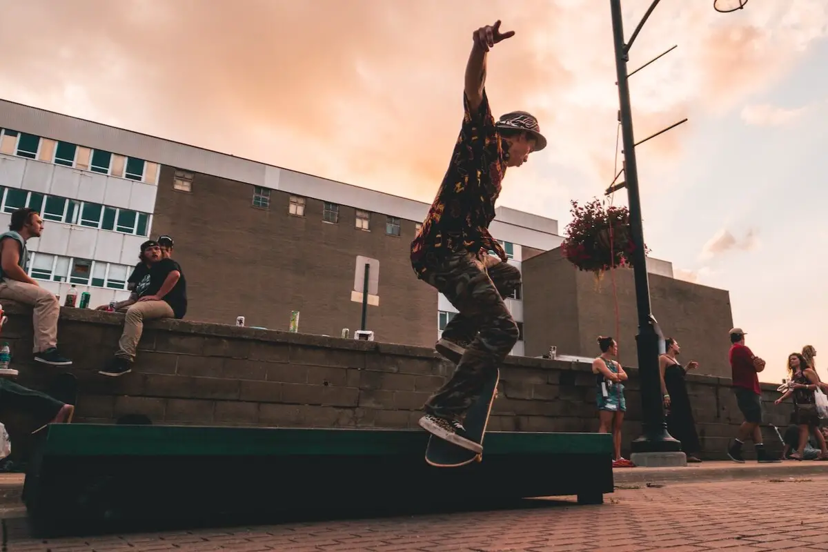 Image of a skater performing a trick on a grind box. Source: unsplash