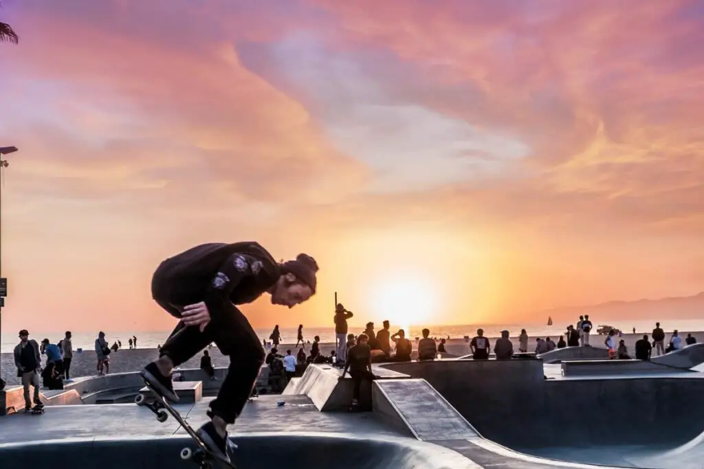 Image of a skater skateboarding in a skate park.