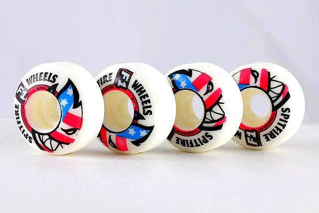 Image of four spitfire skateboard wheels.