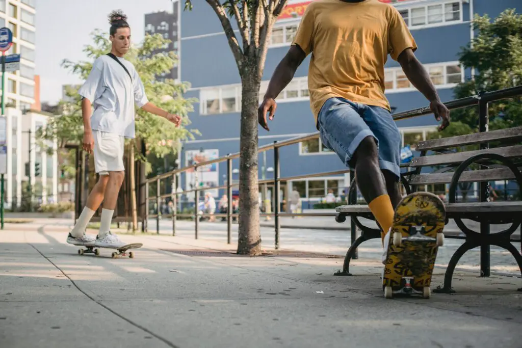 Image of skaters skateboarding on the street.