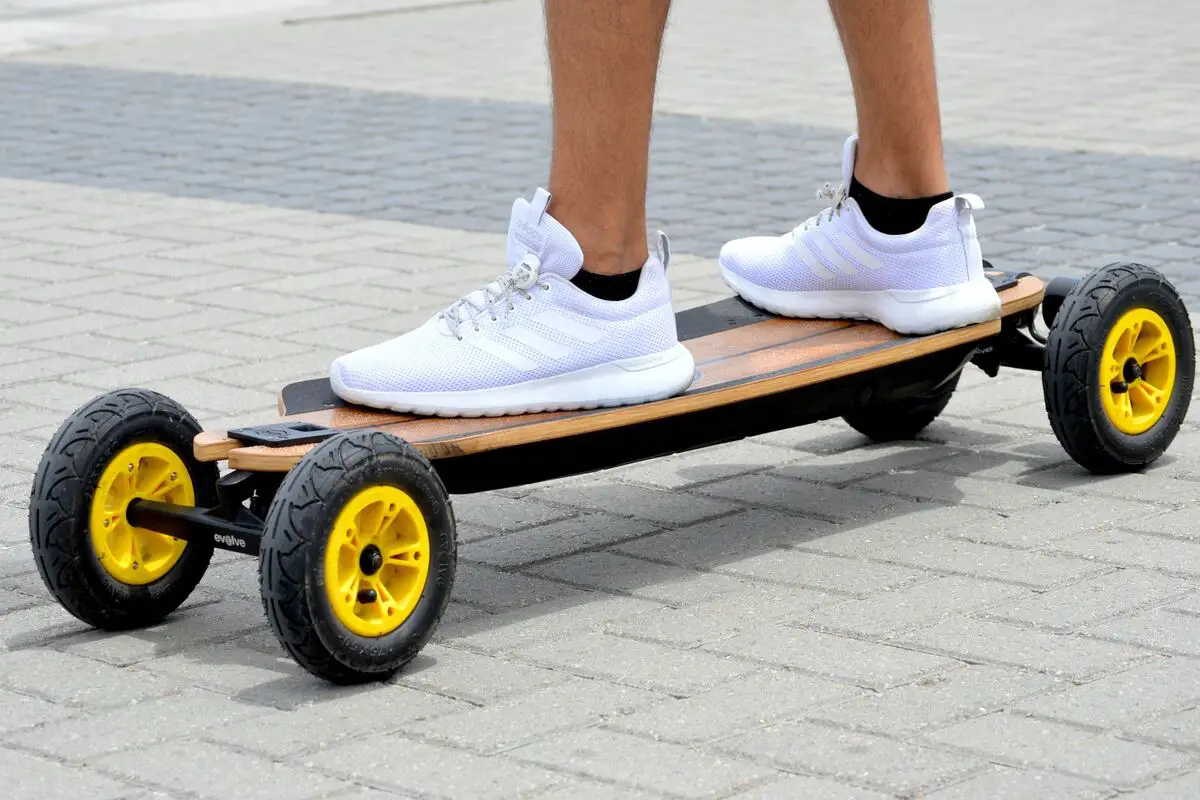 Image of a person riding an electric skateboard. Source: unsplash