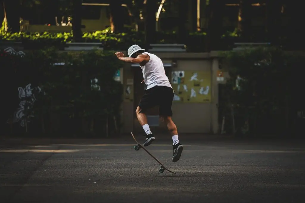 Image of a skater doing ollie skateboarding trick.