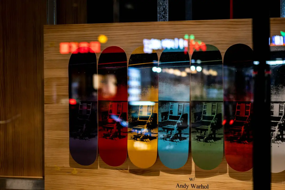Image of three skateboard decks displayed in a skate shop. Source: unsplash