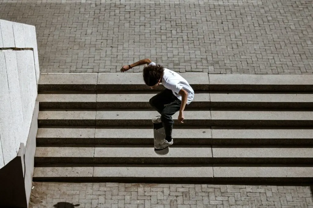 Image of a skater jumping over a flight of stairs. Source: unsplash
