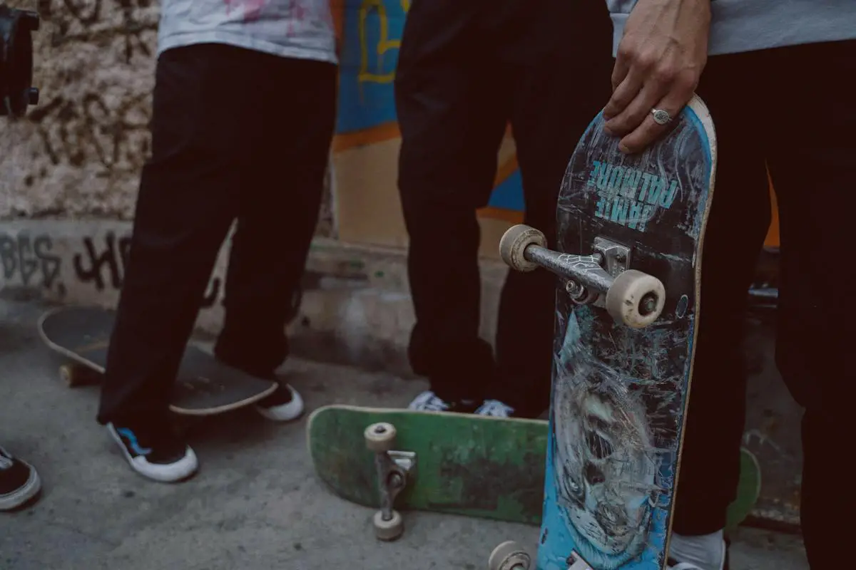 Image of skaters standing with skateboards. Source: pexels